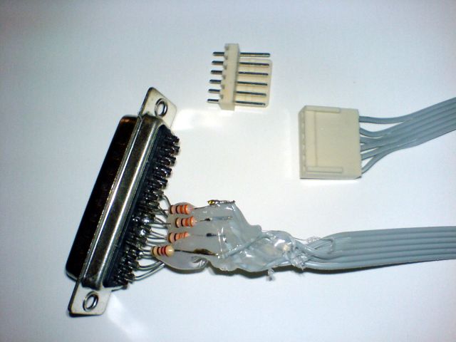 My parallel port programmer, showing the DB-25 connector (to the PC parallel port) and a non-standard 6-pin connector (to the microcontroller circuit).